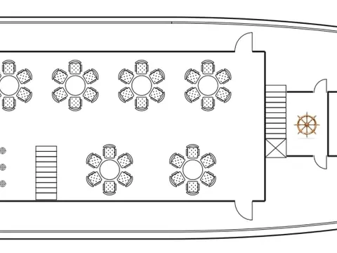 A top-down floor plan diagram of a boat showing dining tables, chairs, a bar area, helm station with steering wheel, and outdoor deck seating.