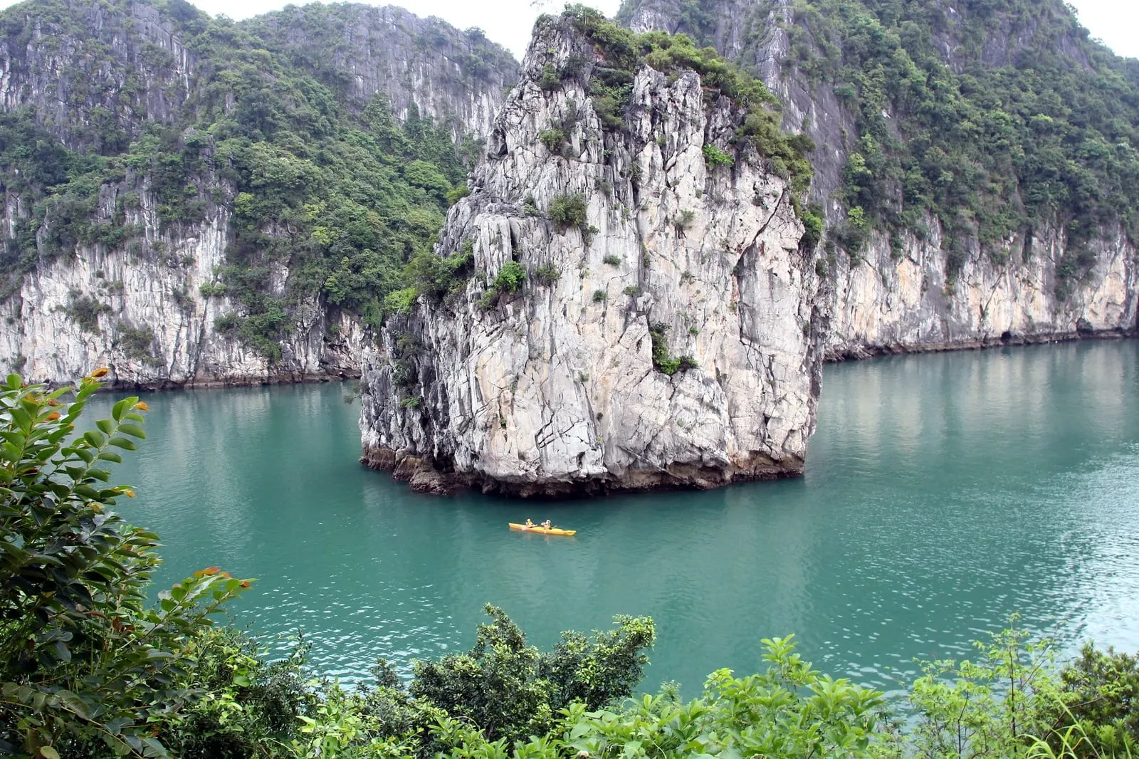 Limestone islands and green water in Bai Tu Long Bay, seen from above