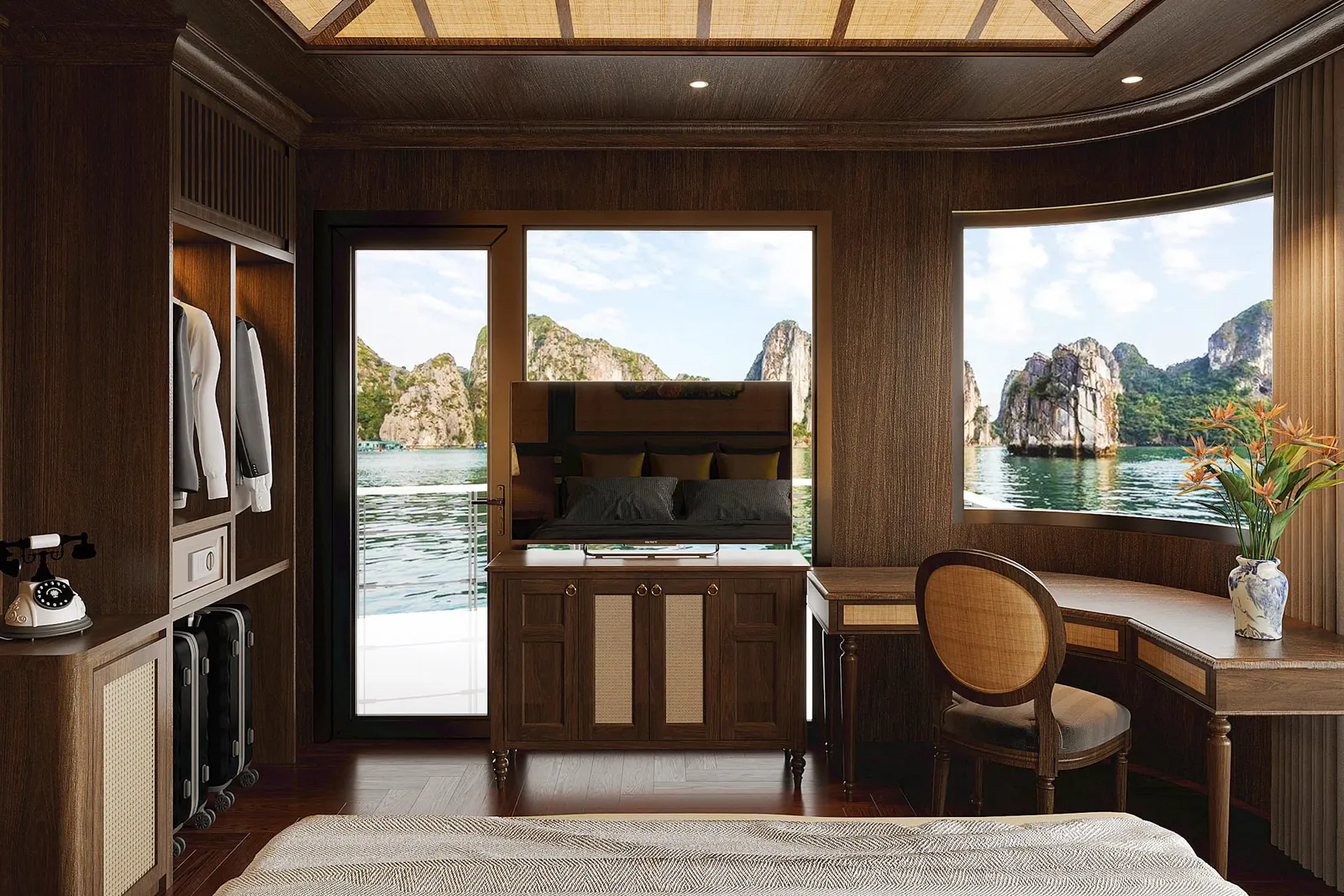 A luxury cabin interior with dark wood paneling, woven ceiling panels, a bed, desk, and open door revealing dramatic limestone karst formations rising from green water outside.
