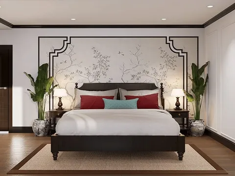 A bedroom interior with a dark wood bed, decorative wall panel with botanical motifs, potted plants, and warm lighting.