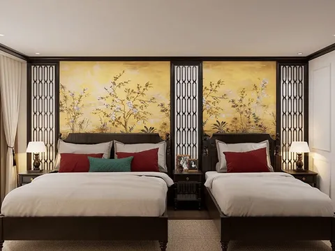 A luxurious cabin interior with two beds, decorative Asian-style wall panels, bedside lamps, and curtained windows.
