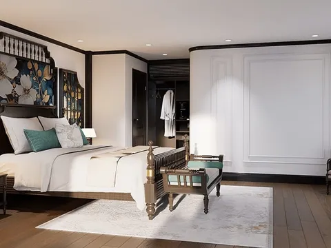 A luxury cabin interior with a double bed, decorative wall panels, wooden furniture, and white paneled walls.