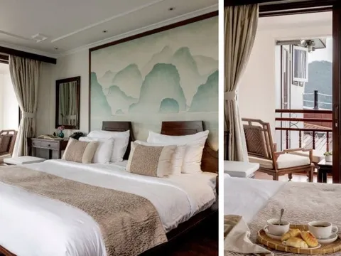 Two side-by-side views of an elegantly furnished cruise cabin with a king bed, wooden furniture, a watercolor mountain mural above the headboard, and a private balcony overlooking karst limestone peaks and water.