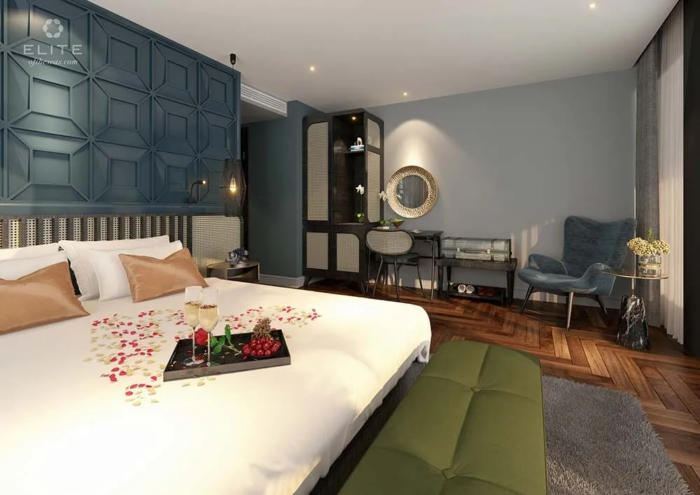 Cabin with a round mirror over the console, an armchair by the window and a tray on the bed