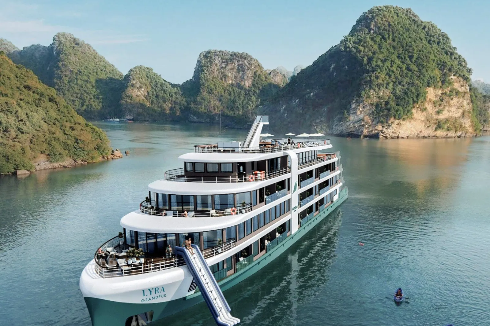 Lyra Grandeur from the air with her waterslide down, moored in a channel between karst islands