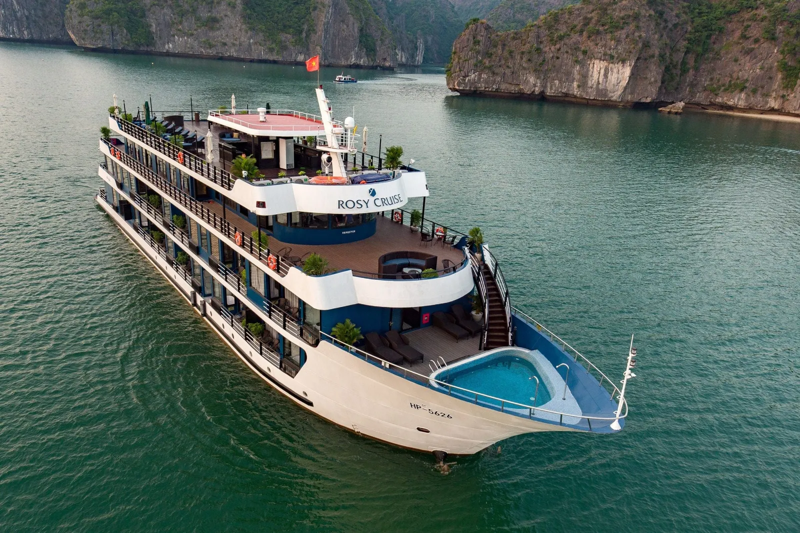 Rosy Cruise from the air, the ship name along her side and a plunge pool set into the bow deck