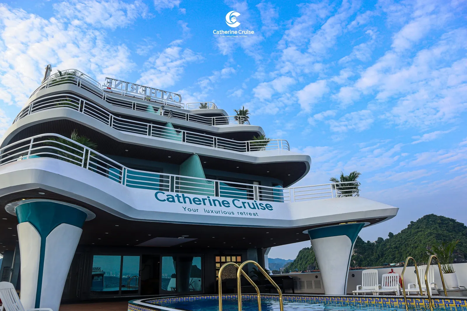 Catherine head on from the water, the ship name and tagline across the white superstructure
